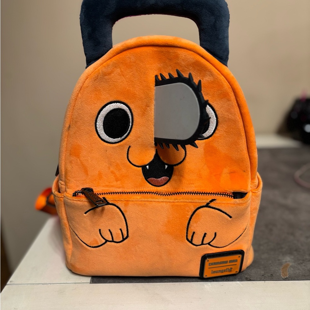 Loungefly Orange and Black Cartoon Face Backpack